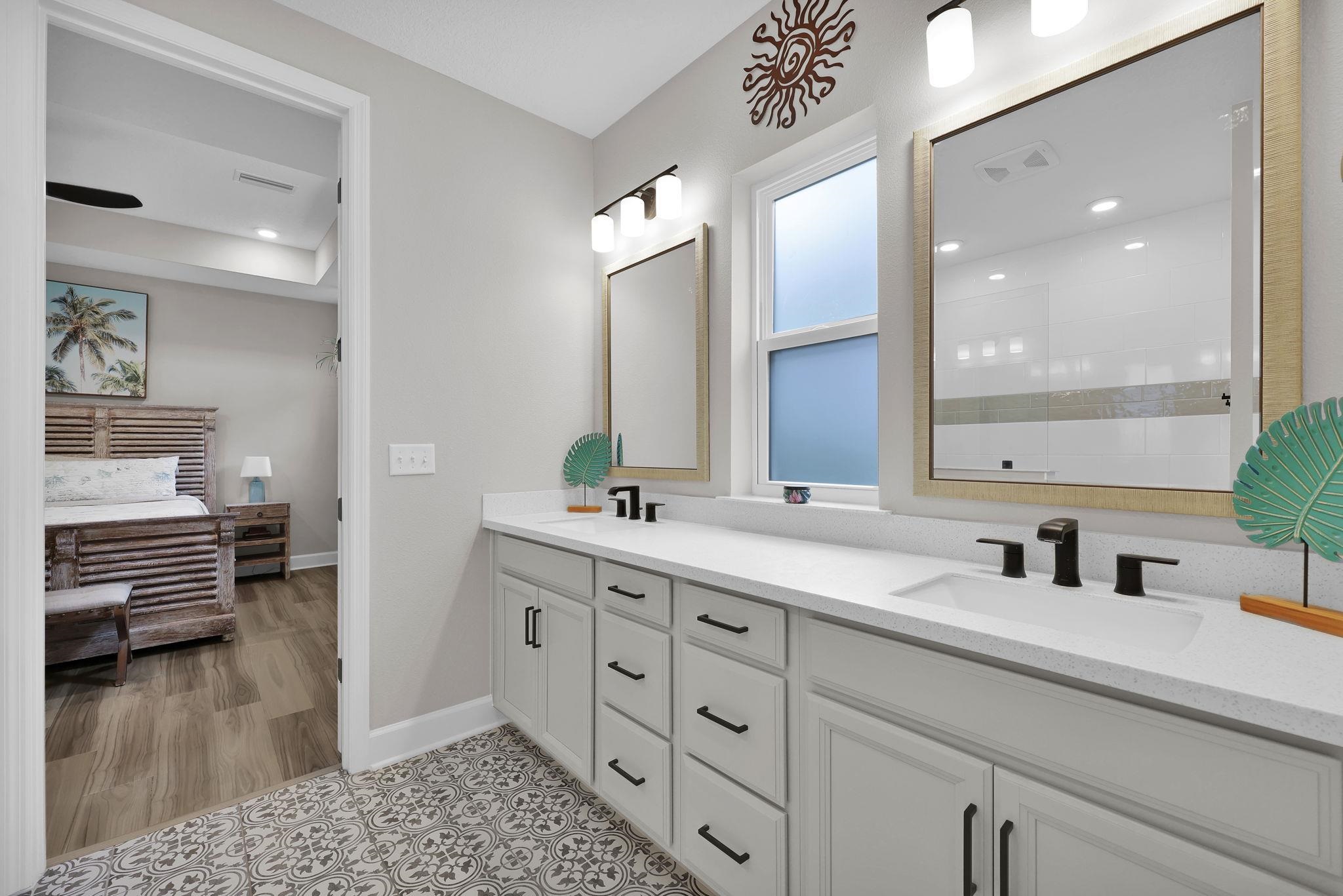 32 Martha Ct. St. Augustine, FL 32092 - Photo 15 of 36 a bathroom with a sink a potted plant and a mirror