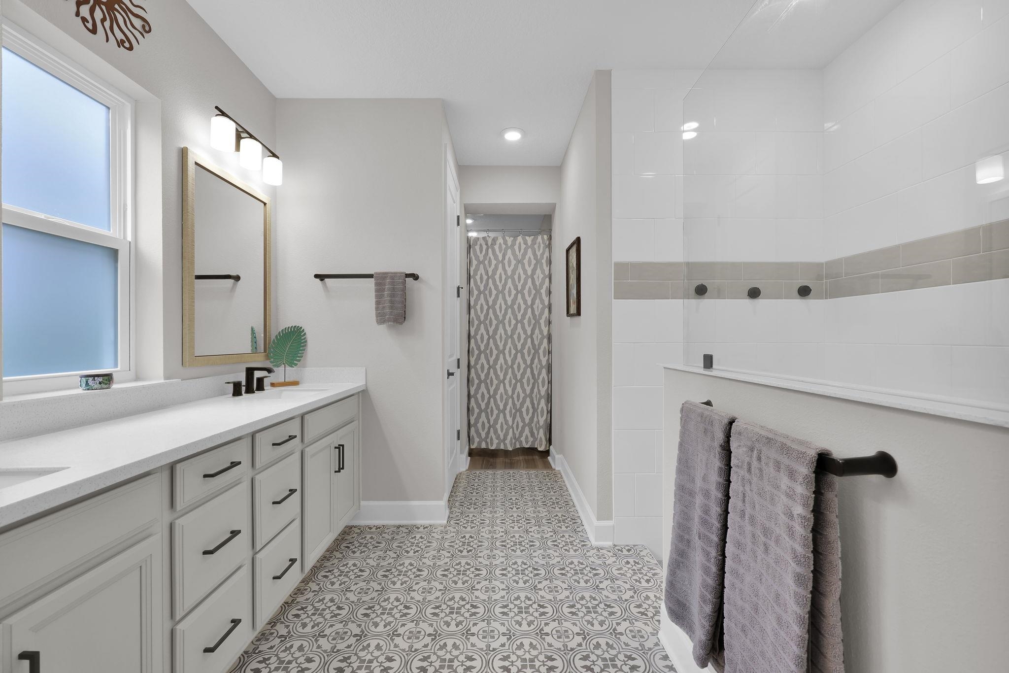 32 Martha Ct. St. Augustine, FL 32092 - Photo 16 of 36 a bathroom with a double vanity sink toilet and shower