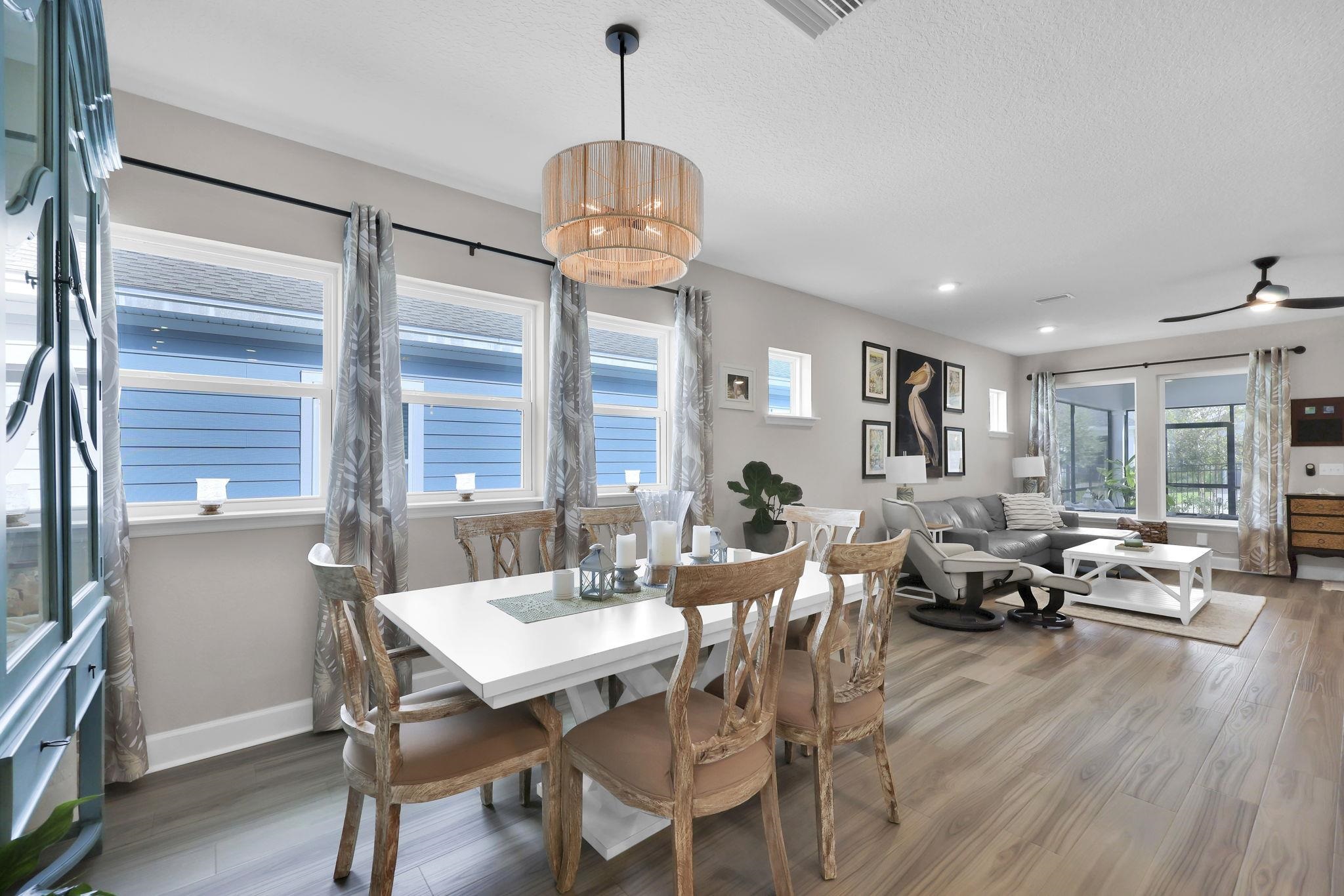 32 Martha Ct. St. Augustine, FL 32092 - Photo 10 of 36 a view of a dining room with furniture window and wooden floor