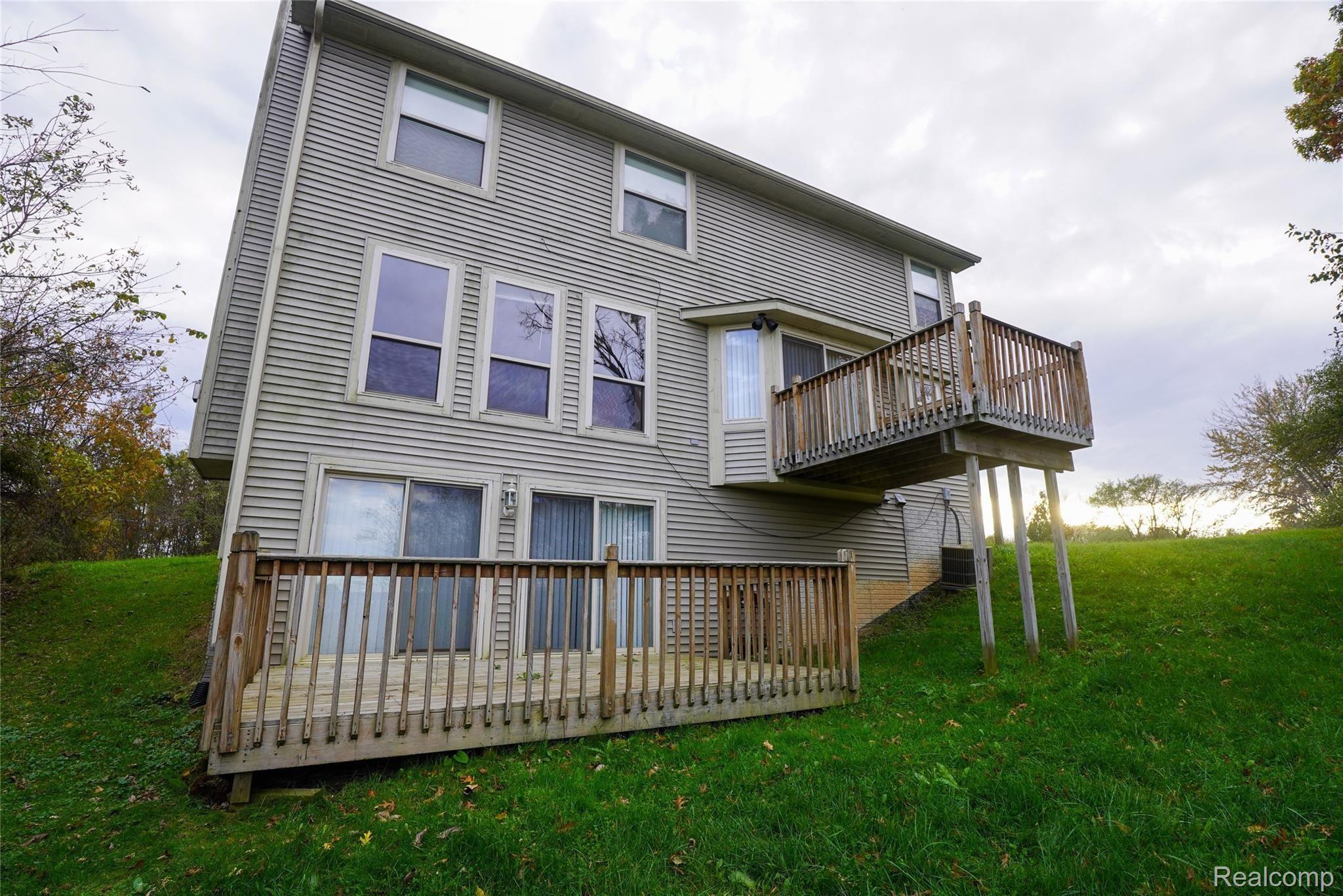 603 East Davisburg Road Holly, MI 48442 - Photo 6 of 29 Back of Home, Has Walkout Lower Level!