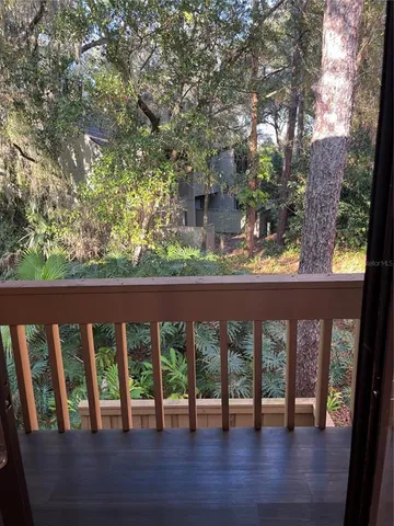 a view of a chairs and table in a balcony