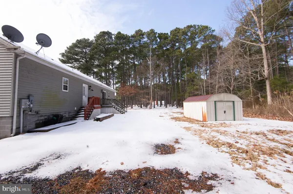 a view of a snow in the yard