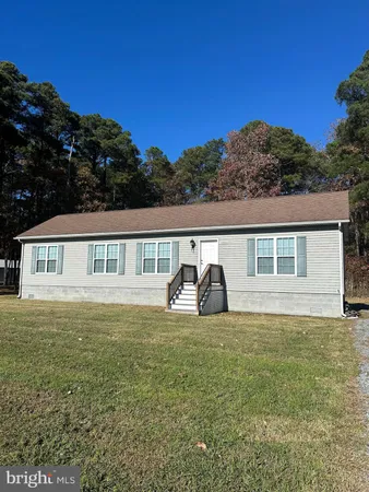 a view of house with garden and deck