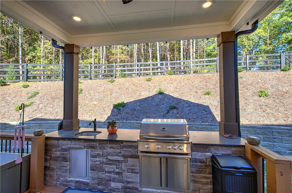 503 London Road Ball Ground, GA 30107 - Photo 41 of 55 a kitchen with a stove top oven
