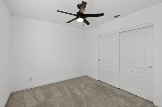 an empty room with fan