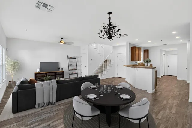a view of a dining room with furniture and wooden floor
