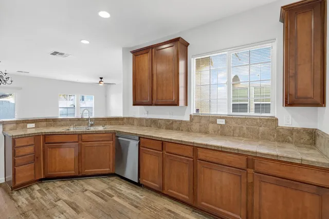 a kitchen with sink and window
