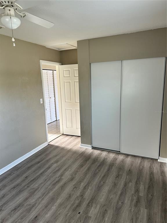 2302 Idaho Road Deltona, FL 32738 - Photo 16 of 22 a view of an empty room with wooden floor