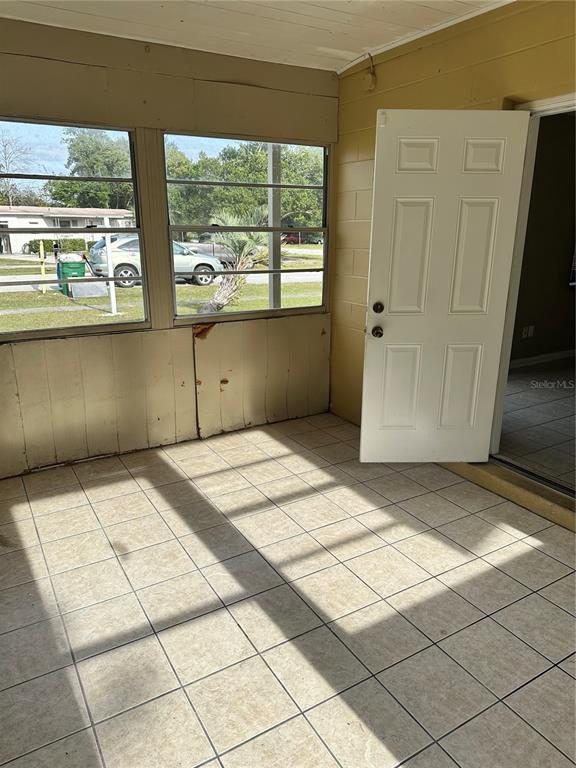 2302 Idaho Road Deltona, FL 32738 - Photo 18 of 22 a bedroom with a bed and a window