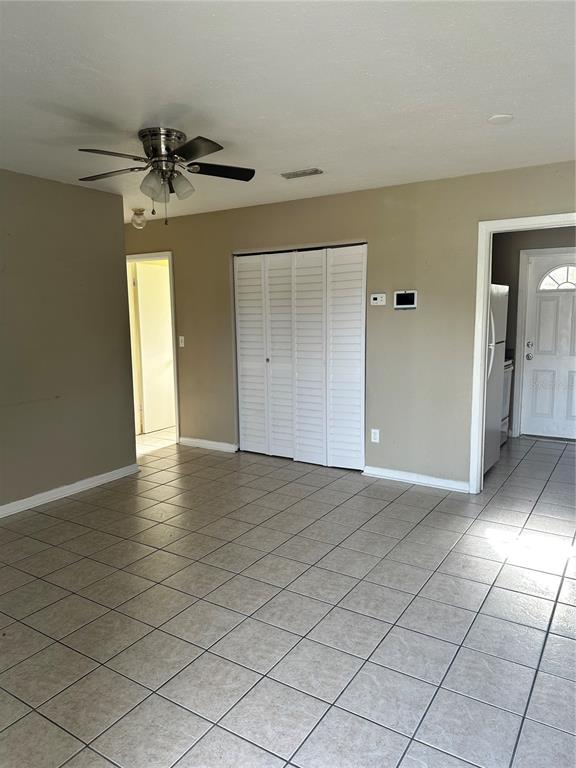 2302 Idaho Road Deltona, FL 32738 - Photo 8 of 22 a view of a livingroom with a ceiling fan and window