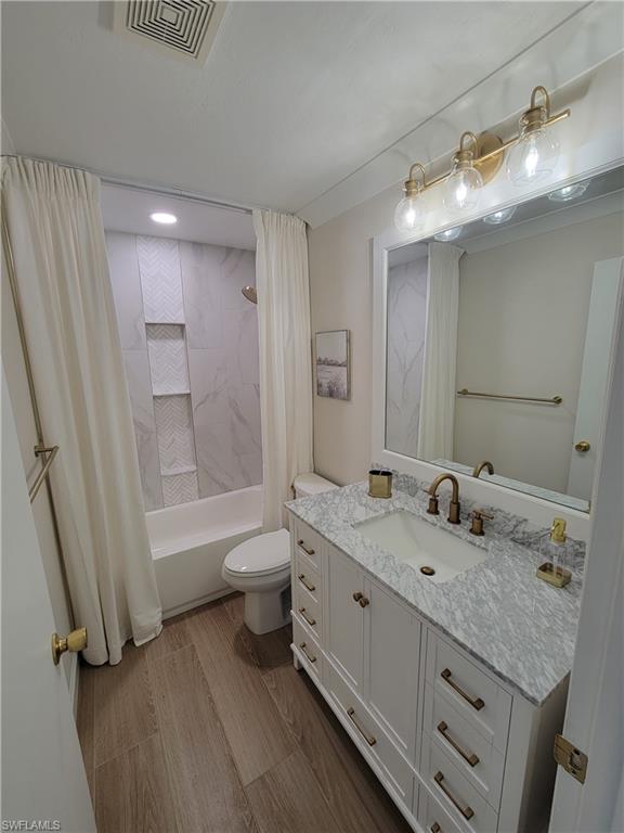 809 Palm View Drive, Unit 8 Naples, FL 34110 - Photo 21 of 26 a bathroom with a granite countertop sink a toilet and shower