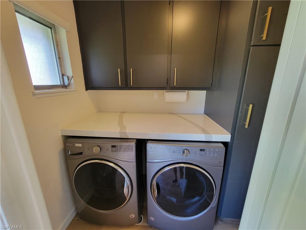 809 Palm View Drive, Unit 8 Naples, FL 34110 - Photo 24 of 26 a utility room with dryer and washer