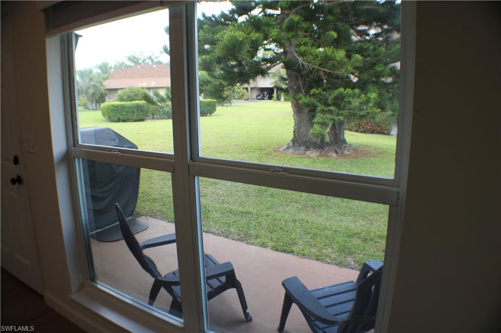 809 Palm View Drive, Unit 8 Naples, FL 34110 - Photo 25 of 26 a view of a room with pool table and chairs