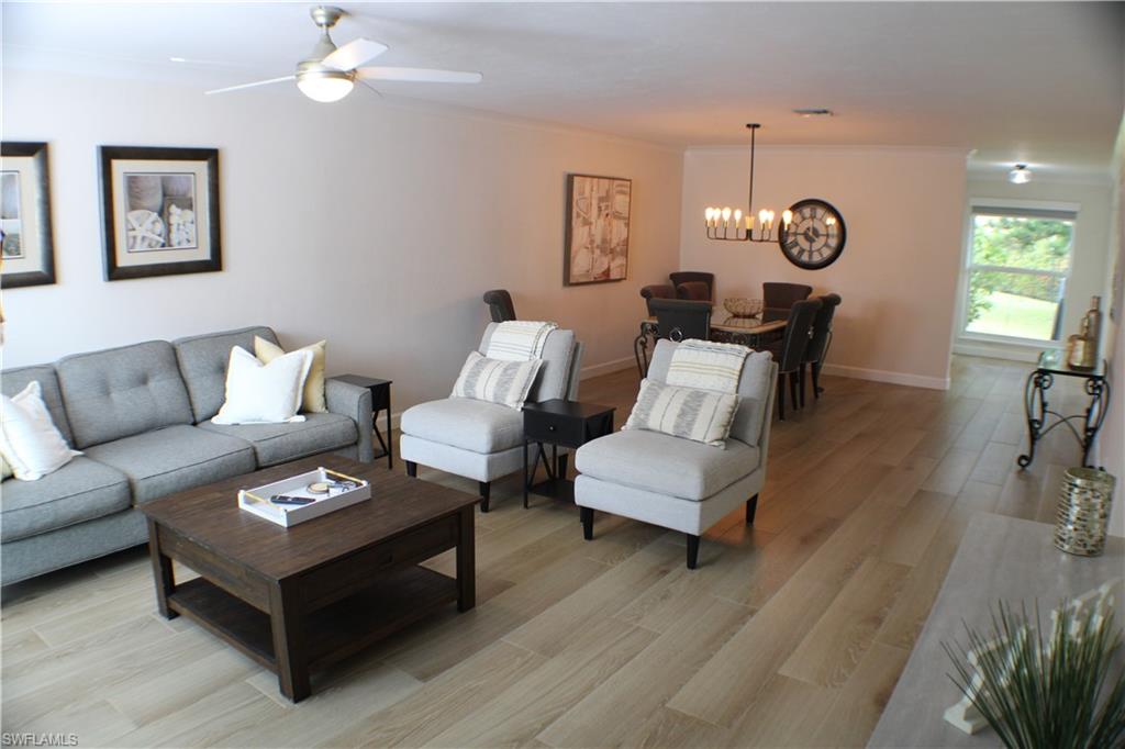 809 Palm View Drive, Unit 8 Naples, FL 34110 - Photo 4 of 26 a living room with furniture