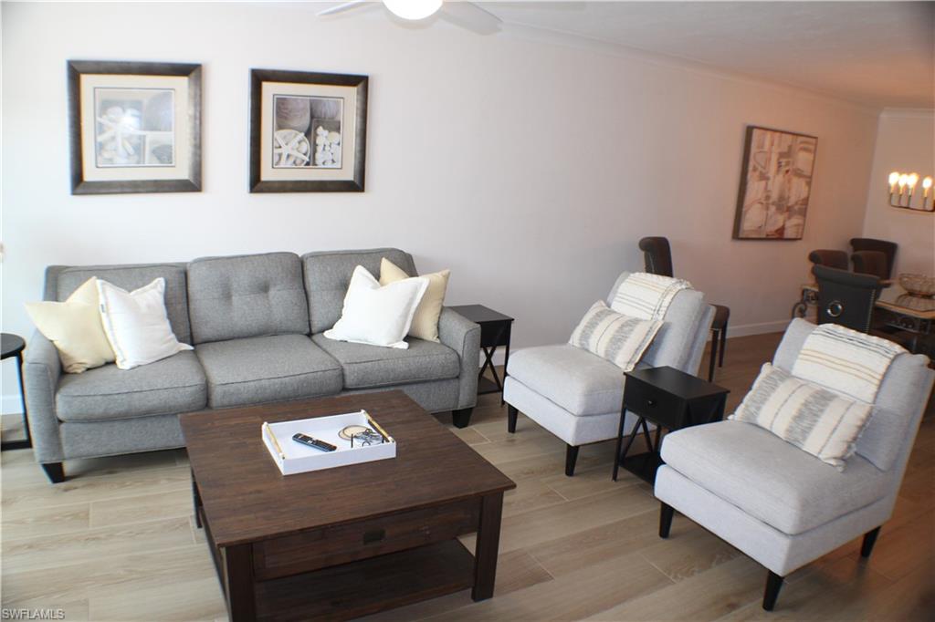 809 Palm View Drive, Unit 8 Naples, FL 34110 - Photo 5 of 26 a living room with furniture