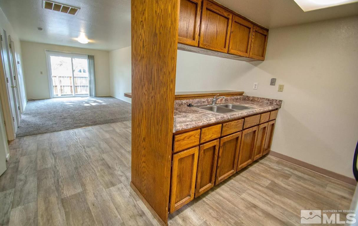360 Jill Court, Unit 6 Fernley, NV 89408 - Photo 4 of 9 a view of a kitchen from a hallway