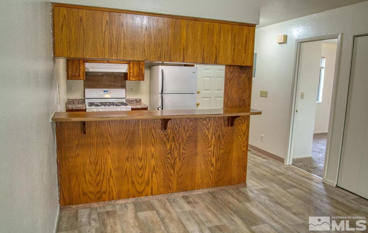 360 Jill Court, Unit 6 Fernley, NV 89408 - Photo 5 of 9 a view of a kitchen with appliances