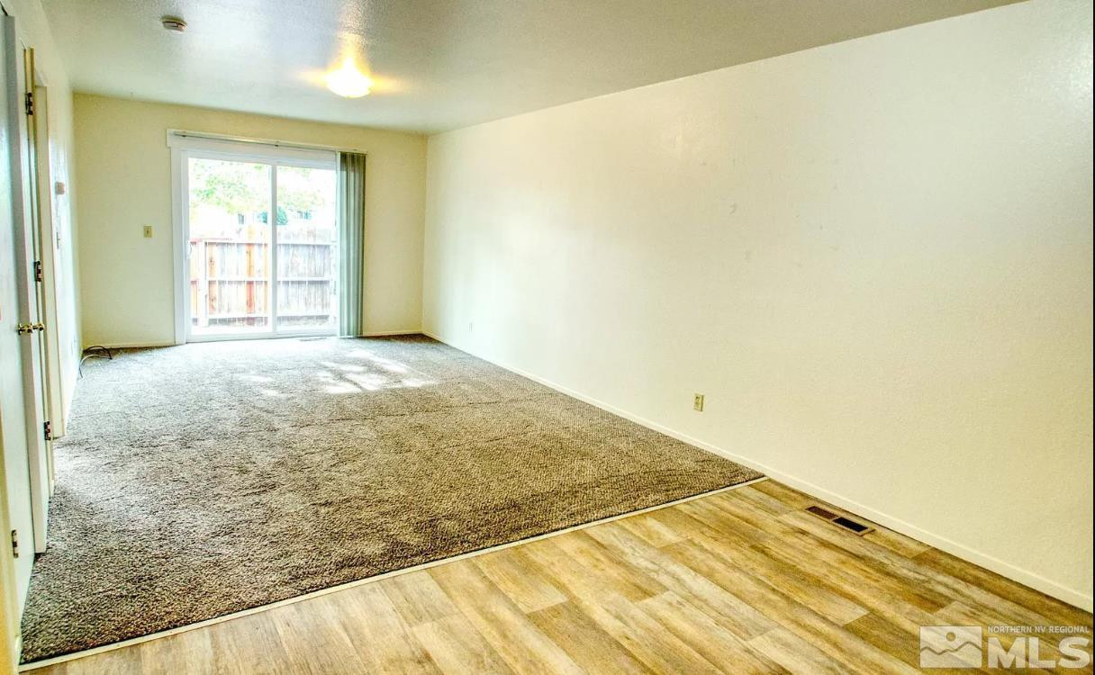 360 Jill Court, Unit 6 Fernley, NV 89408 - Photo 8 of 9 a view of empty room with wooden floor