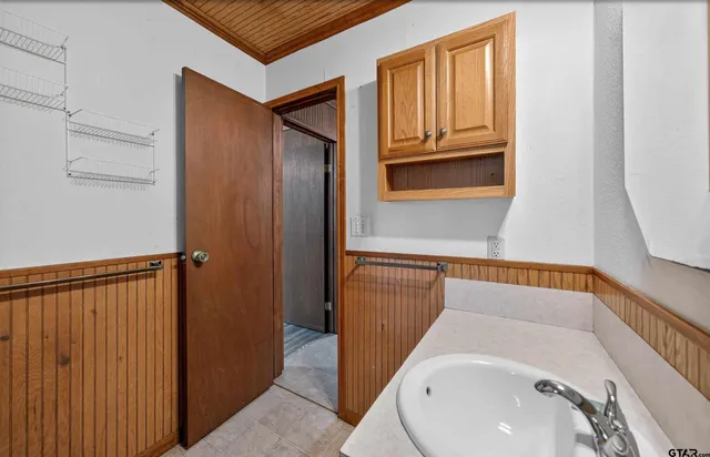 a bathroom with a sink and a mirror