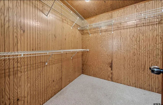 a view of a room with wooden walls