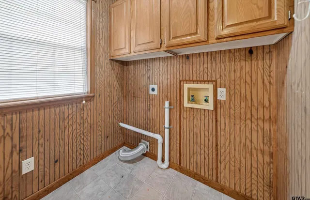 a view of a hallway with wooden door