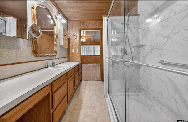 a bathroom with a double vanity sink and mirror