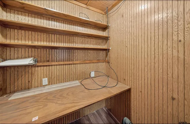a view of a wooden floor with a window