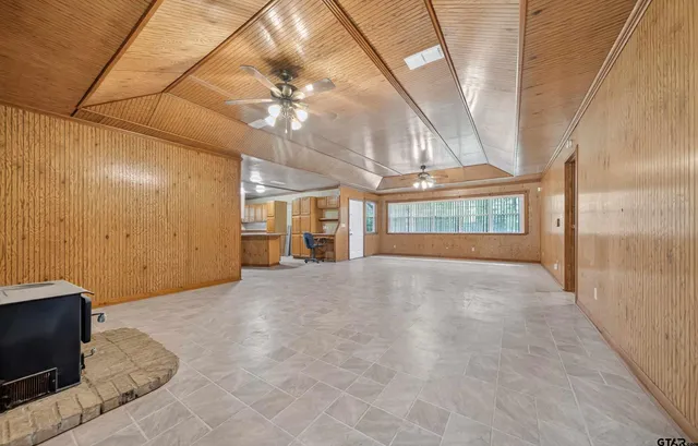 a view of an empty room with a chandelier