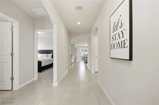 a view of a hallway with a living room