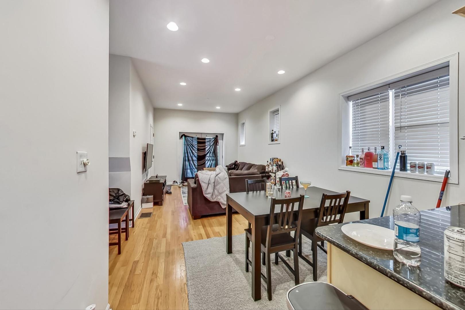 1119 West Addison Street Chicago, IL 60613 - Photo 3 of 36 a view of a dining room with furniture