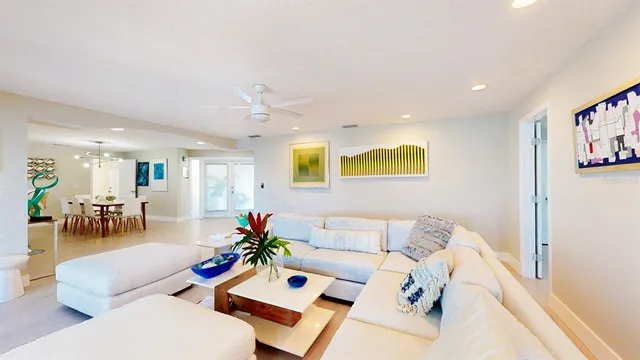 a living room with furniture and a mirror
