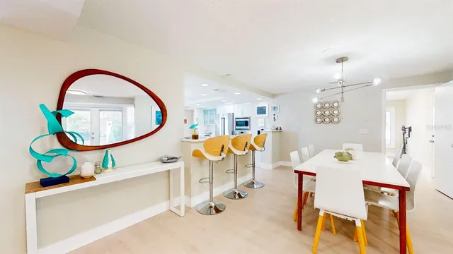 a kitchen with stainless steel appliances a refrigerator sink and stove