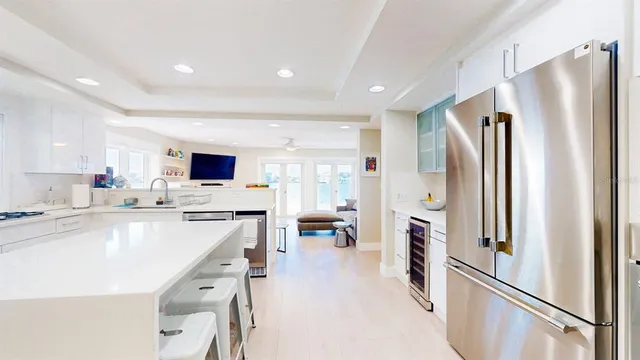 a kitchen with a stove a sink and a refrigerator