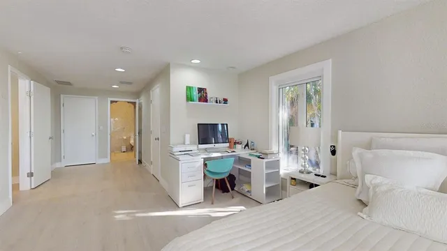 a bathroom with a toilet sink and shower