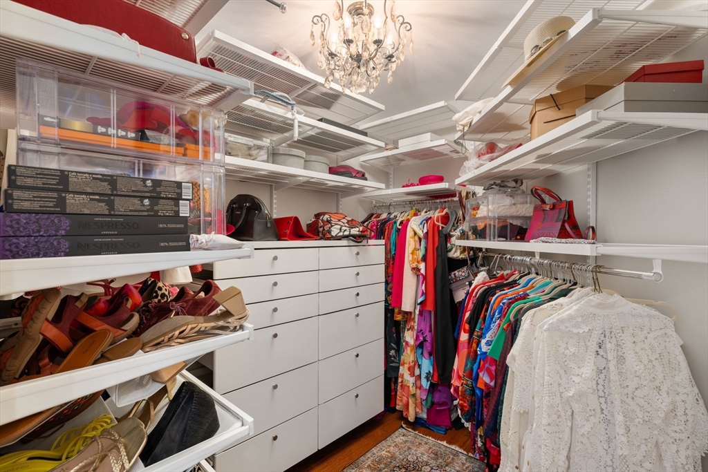 55 Radcliffe Road Weston, MA 02493 - Photo 21 of 38 a view of walk in closet with clothes