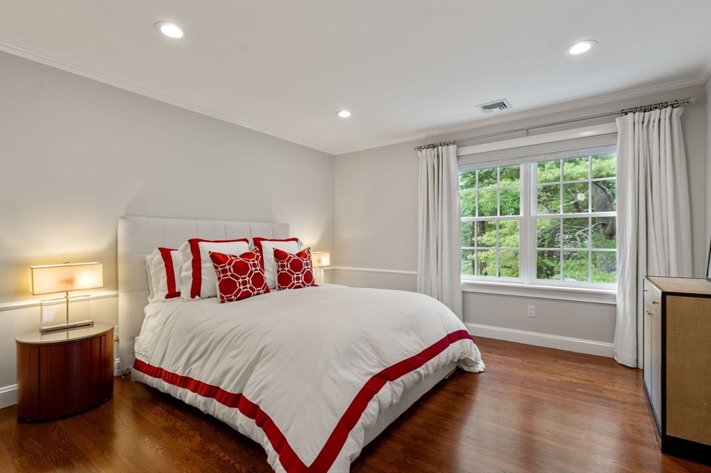 55 Radcliffe Road Weston, MA 02493 - Photo 22 of 38 a bedroom with a large bed and a large window