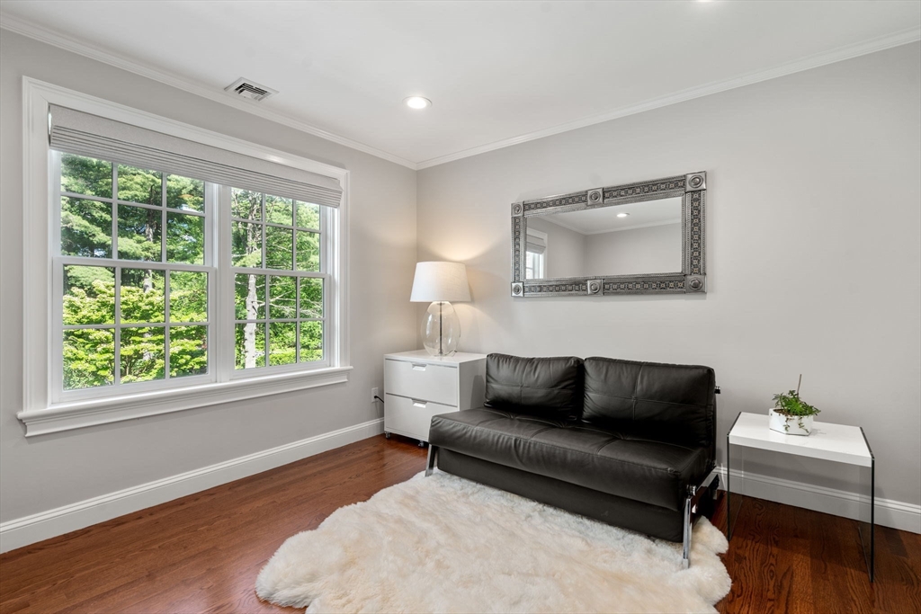 55 Radcliffe Road Weston, MA 02493 - Photo 25 of 38 a living room with furniture and a window
