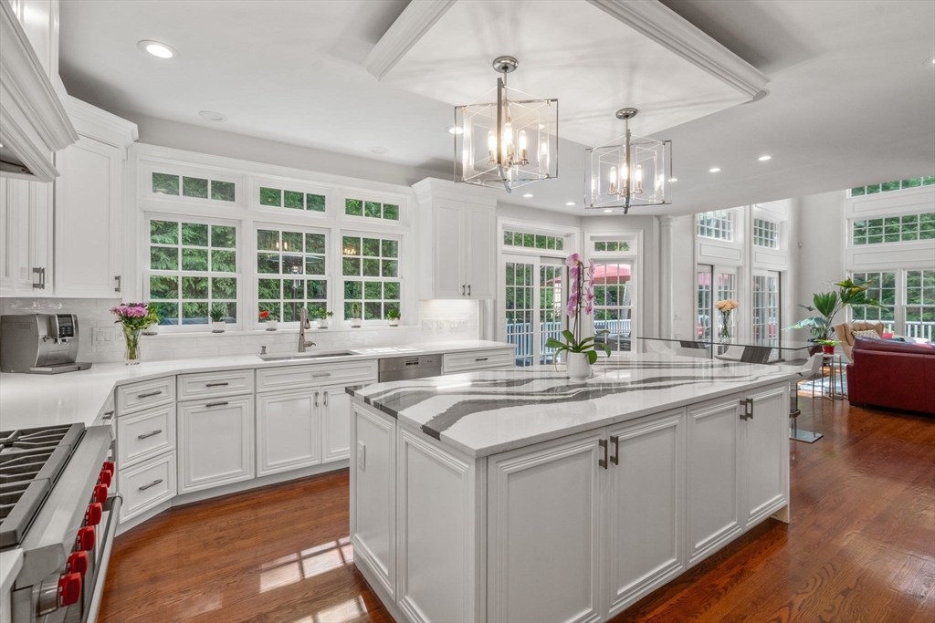 55 Radcliffe Road Weston, MA 02493 - Photo 3 of 38 a kitchen with center island and sink