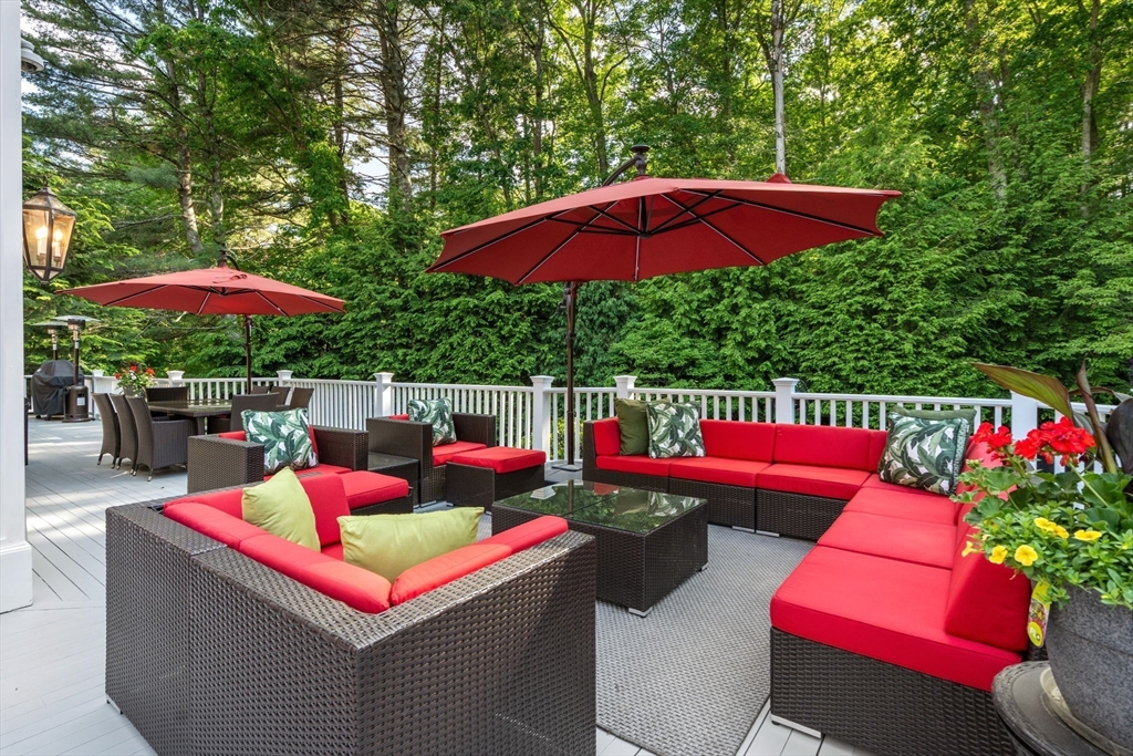 55 Radcliffe Road Weston, MA 02493 - Photo 31 of 38 an outdoor sitting area with red umbrella