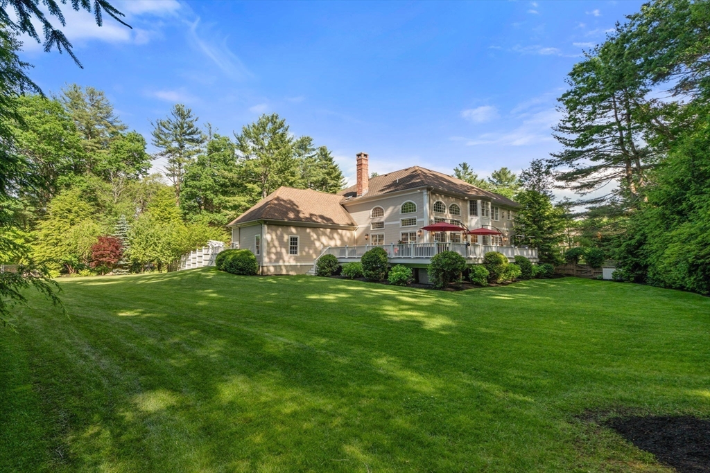 55 Radcliffe Road Weston, MA 02493 - Photo 34 of 38 a view of a big yard with plants and large trees