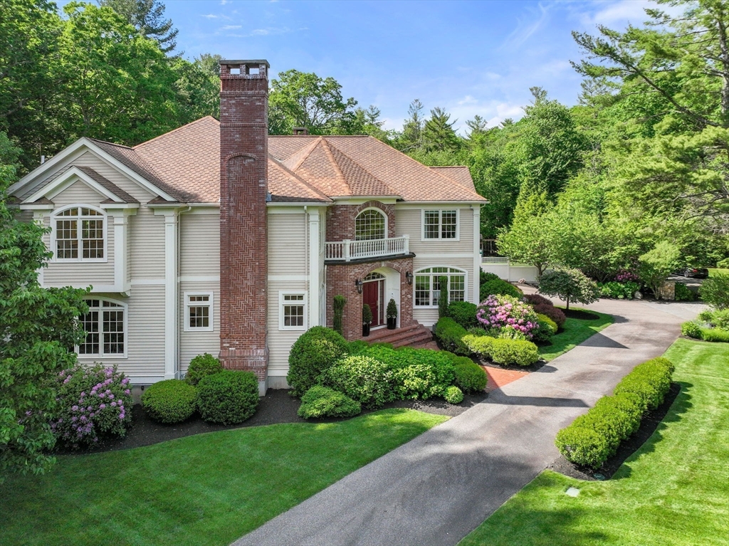 55 Radcliffe Road Weston, MA 02493 - Photo 36 of 38 a front view of a house with a garden