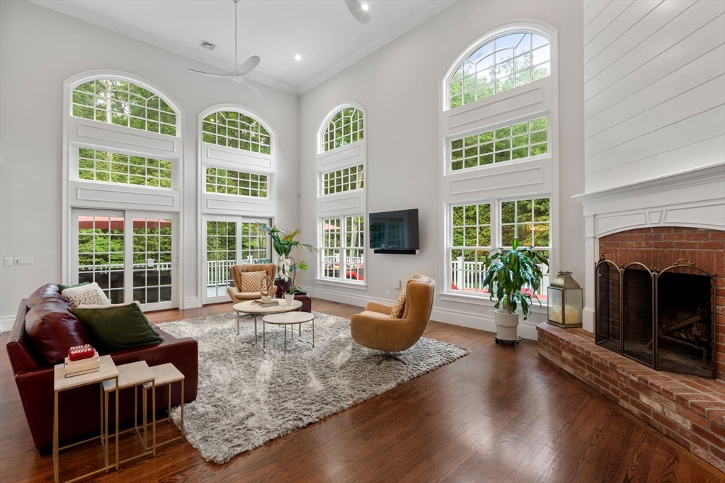 55 Radcliffe Road Weston, MA 02493 - Photo 7 of 38 a living room with fireplace furniture and a large window