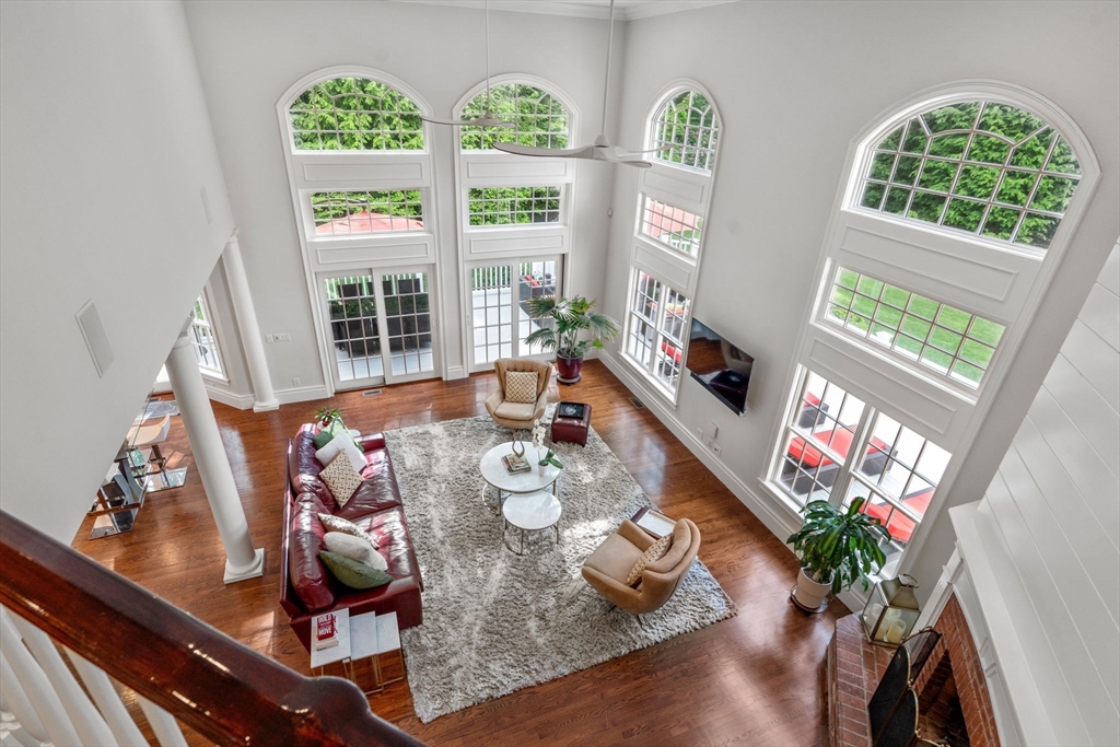 55 Radcliffe Road Weston, MA 02493 - Photo 9 of 38 a living room with furniture and a floor to ceiling window