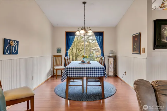 a dining room with furniture and window