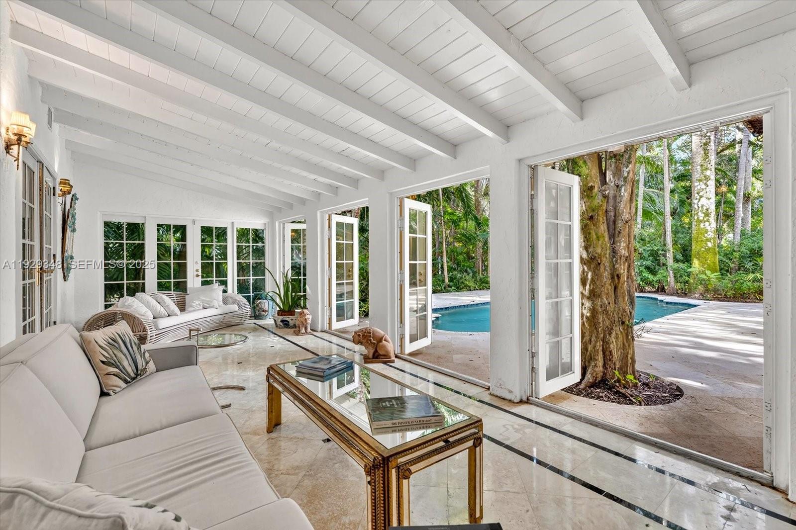 4190 Ingraham Highway Miami, FL 33133 - Photo 12 of 26 a living room with furniture and large windows