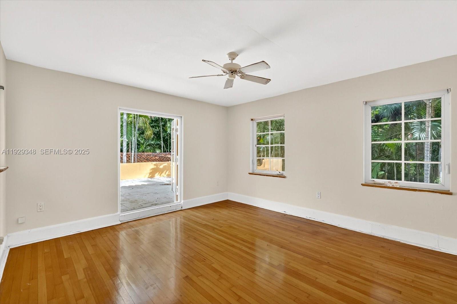 4190 Ingraham Highway Miami, FL 33133 - Photo 15 of 26 wooden floor in an empty room with a window