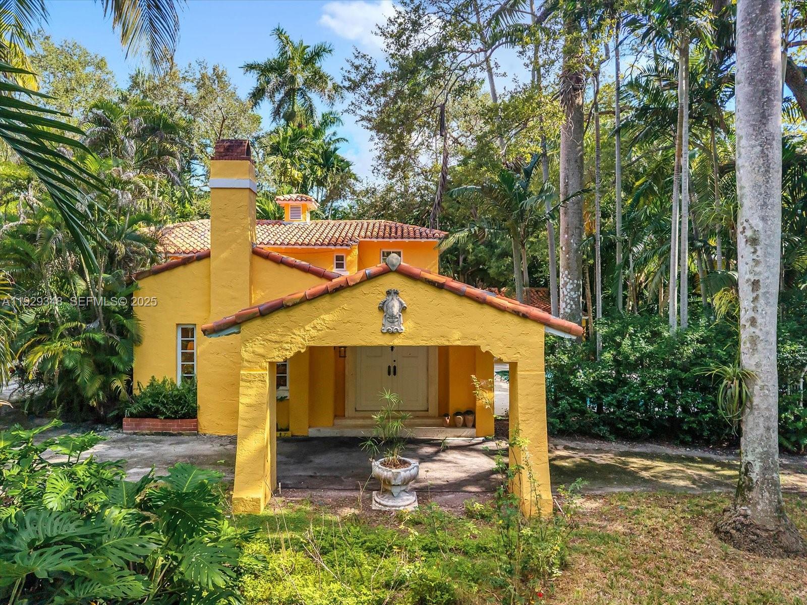 4190 Ingraham Highway Miami, FL 33133 - Photo 2 of 26 a front view of a house with garden