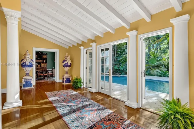 a living room with fireplace furniture and a rug