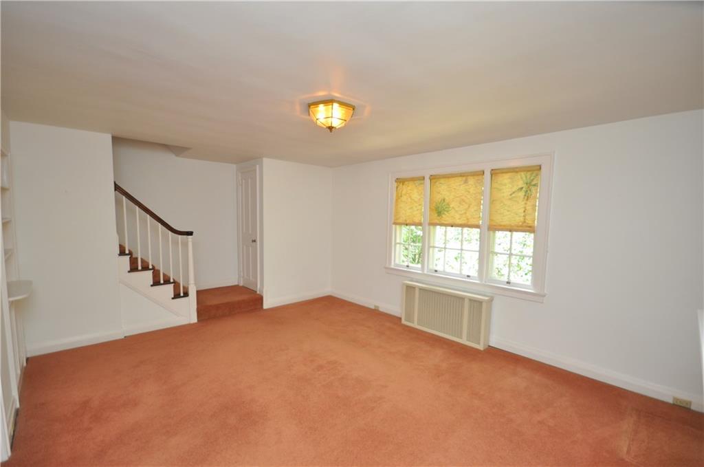 418 Sulgrave Road Pittsburgh, PA 15211 - Photo 4 of 17 a view of an empty room with a window
