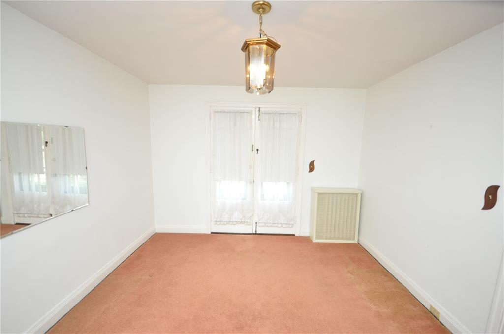 418 Sulgrave Road Pittsburgh, PA 15211 - Photo 5 of 17 a view of empty room with wooden floor